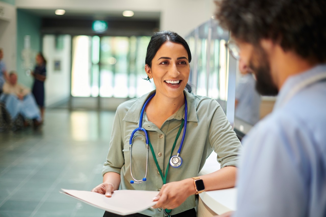 hospital doctor chatting to colleague